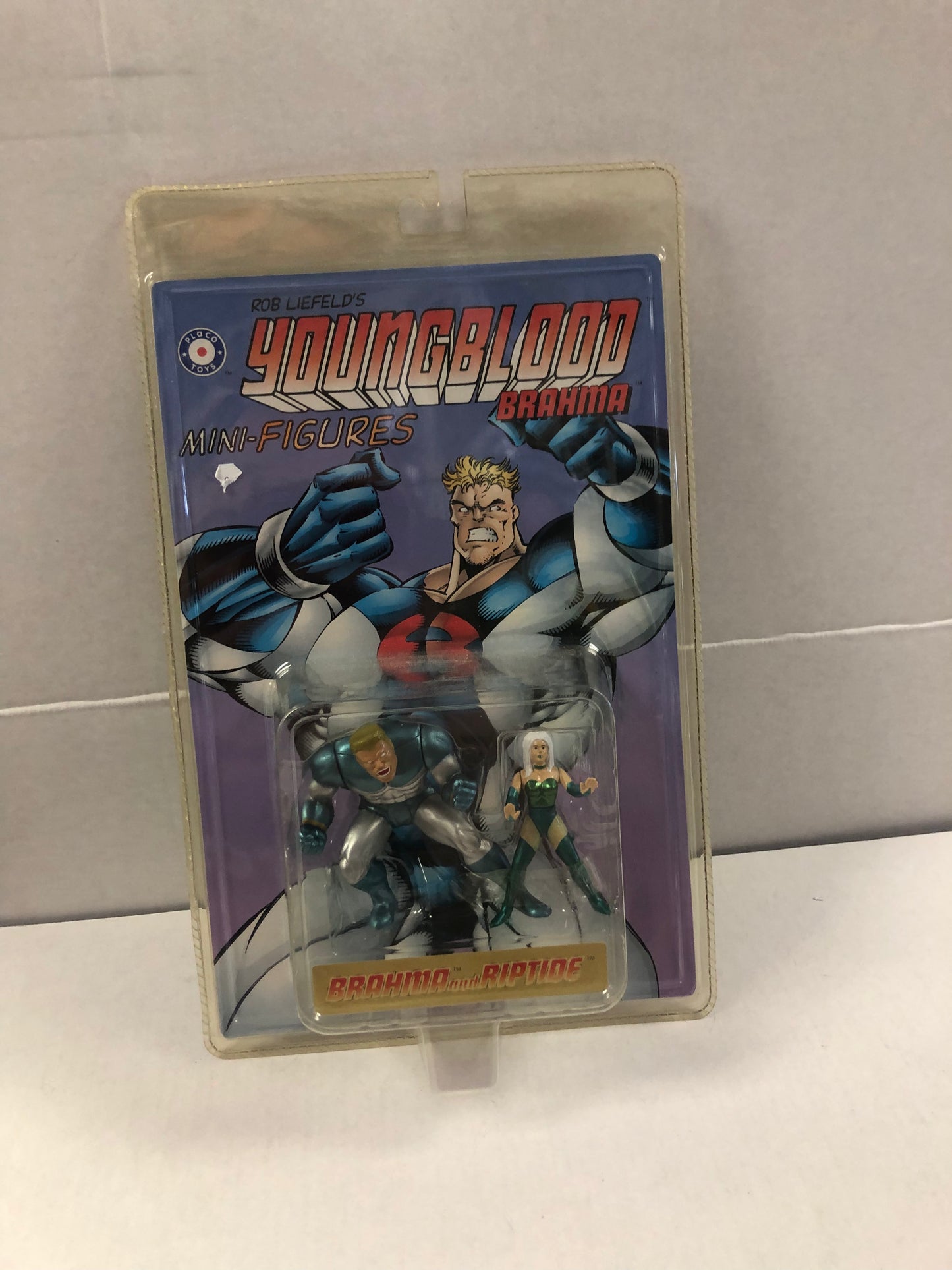 PLACO TOYS YOUNGBLOOD BRAHMA MINI FIGURES BRAHMA AND RIPTIDE OKAY CONDITION YELLOWING ON PACKAGE