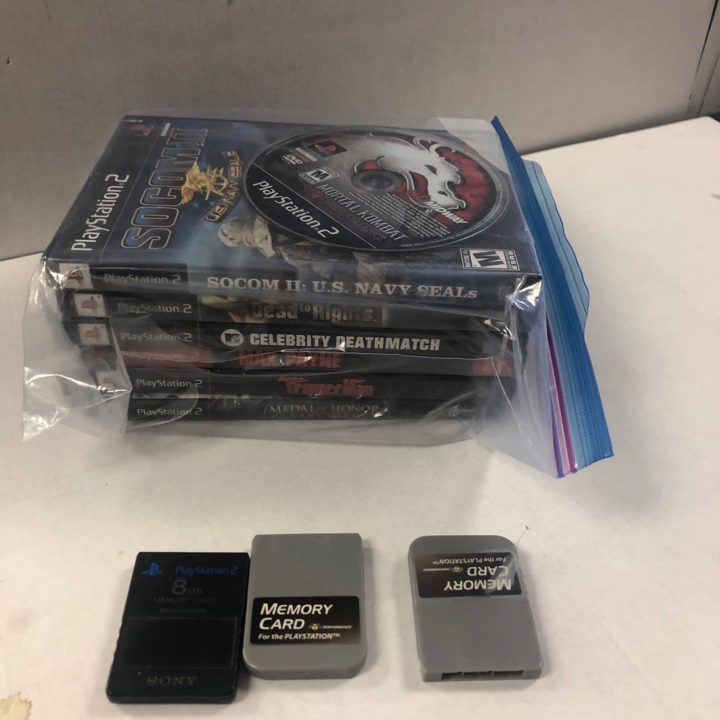 PLAYSTATION 2 CONSOLE COMES WITH 3 CONTROLLERS 3 MEMORY CARDS 7 GAMES POWER CORD MISSING AV CABLE